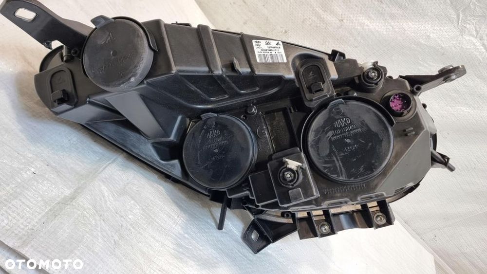 Opel Combo D lampa lewa przód przednia 520868580E - 9