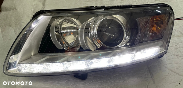 Audi A6 C6 4F Lift reflektor lewy lampa bi xenon nieskrętna nowa oryginał