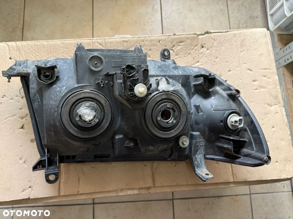 Reflektor / lampa przód przednia lewa Toyota Land Cruiser 100 LC100  - oryginalna - 3