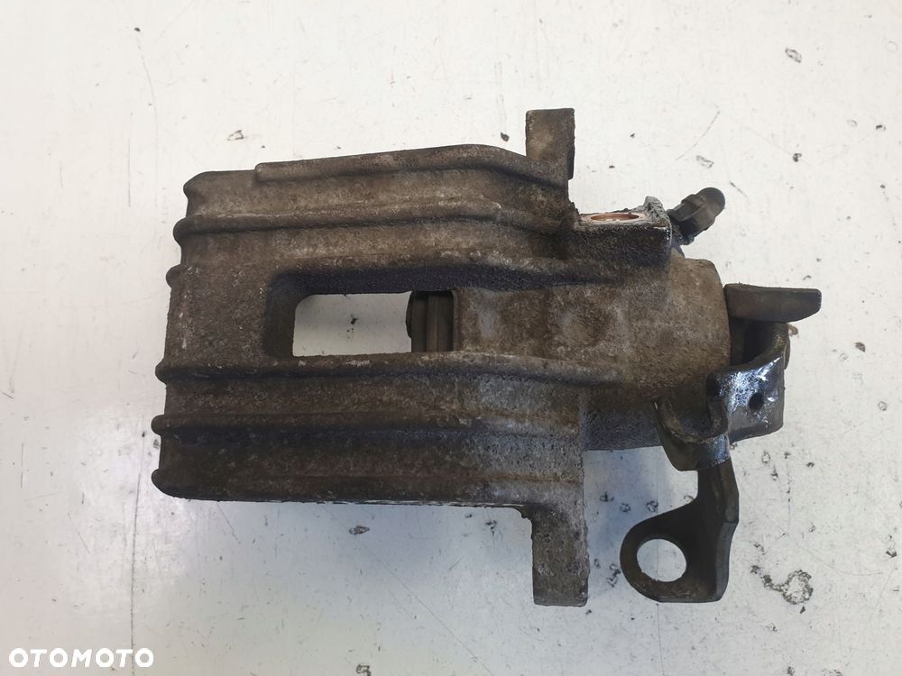 Skoda Octavia I ZACISK HAMULCOWY lewy TYŁ TYLNY - 1