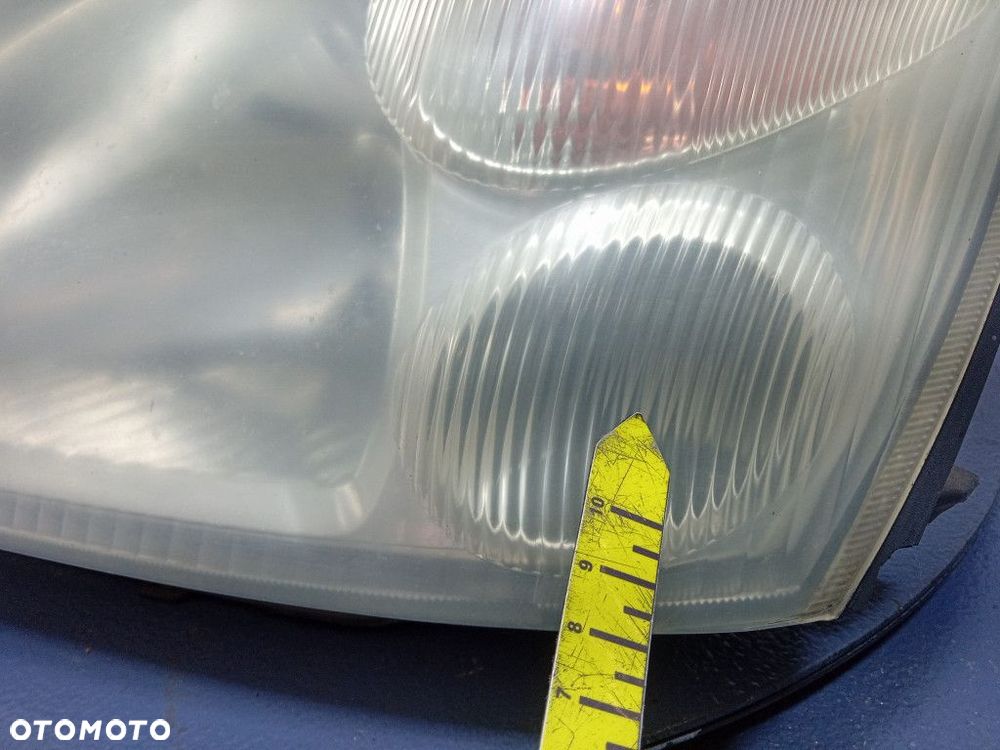 SUZUKI LIANA REFLEKTOR LEWY LAMPA PRZEDNIA EU 100-32662 - 8