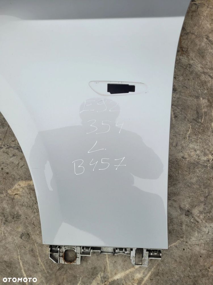BŁOTNIK LEWY PRZÓD PRZEDNI BMW E92 E93 354 TITANSILBER B457 - 2