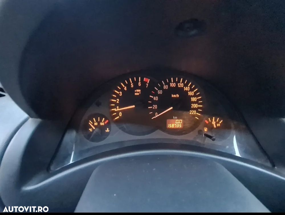 Opel Corsa 1.2i Cosmo - 1