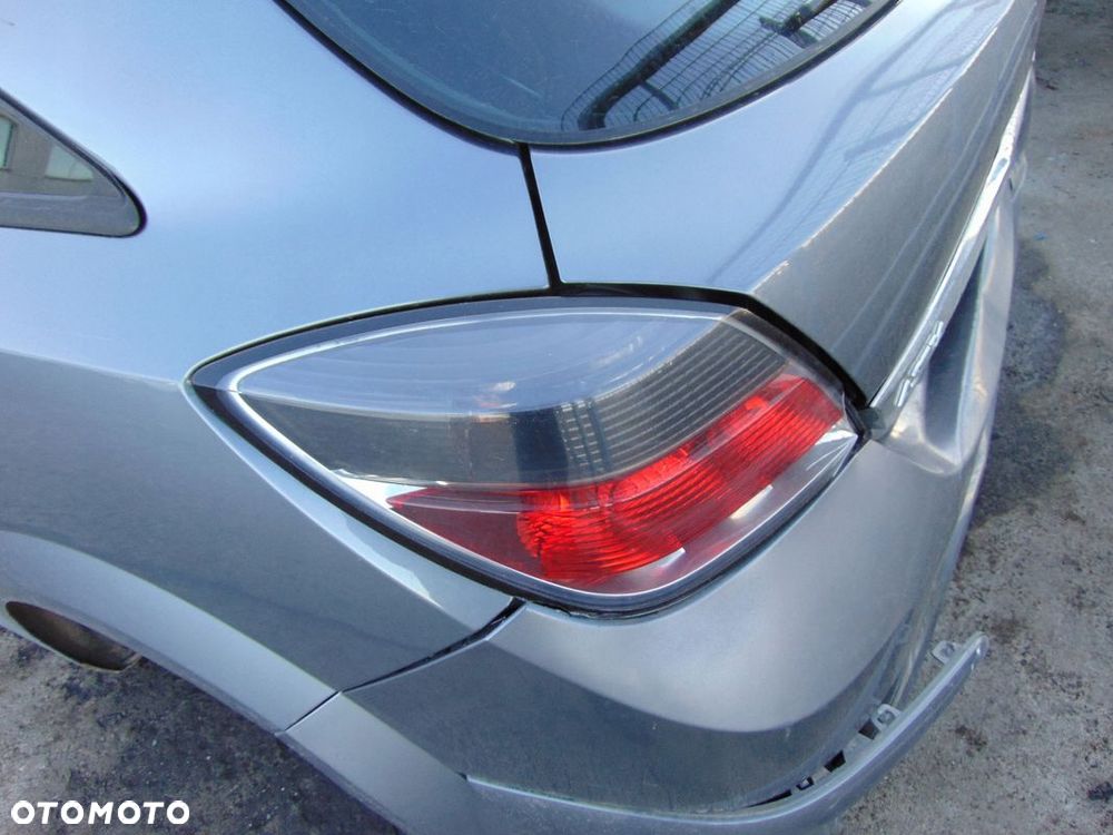 LAMPA LEWA TYŁ TYLNIA CIEMNA EUROPA OPEL ASTRA III H GTC Z155 3D - 1