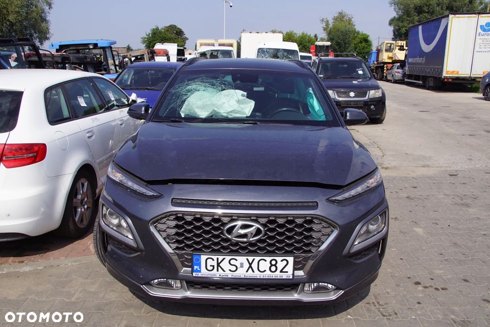 Auto na części - Hyundai Kona I 1.6 T-GDI 177 KM G4FJ D7UF1 YG7 2019R Silnik Skrzynia Drzwi Maska Błotnik Zderzak Klapa Lampa Lusterko Klamka Szyba Deska Kokpit Sterownik Moduł Czujnik Licznik Wyświetlacz Panel Kierownica - 2