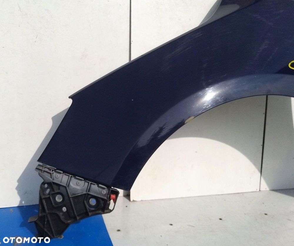BŁOTNIK PRZEDNI LEWY OPEL ASTRA IV J - 2