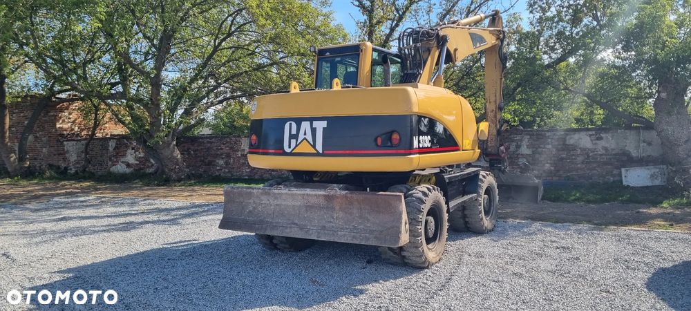 Caterpillar M313C - 3