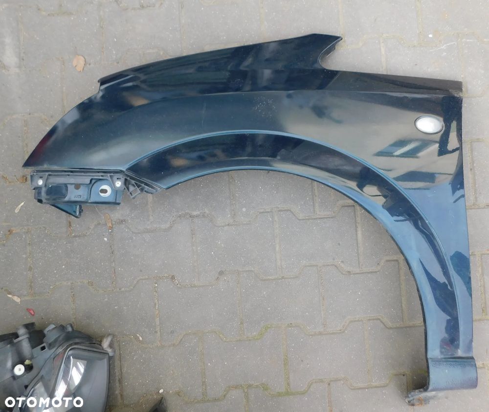 błotnik lewy prawy przód OPEL MERIVA A z168 morski
