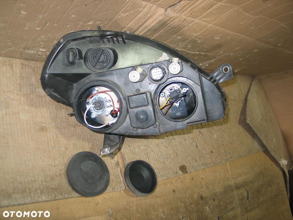 lampa przod lancia ypsilon 2 II lift 06-11r. oryginal europa - 13