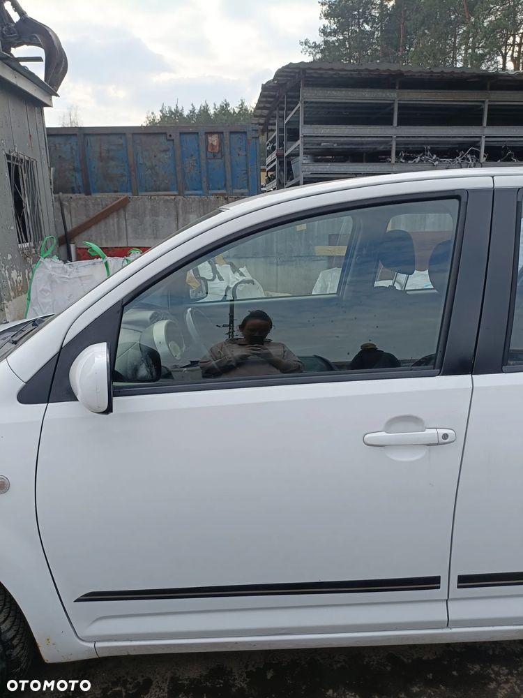 DAIHATU SIRION II 04-10 r. W09 DRZWI lewy przód lewe ** - 2