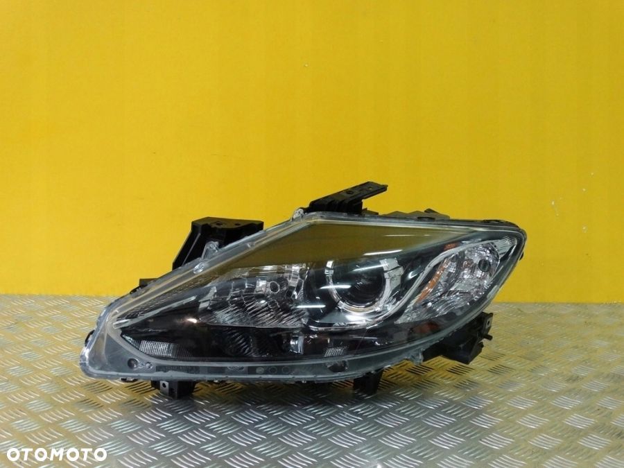 MAZDA CX9 LIFT 2012- REFLEKTOR LAMPA ZWYKŁA SOCZEWKOWA LEWA USA - 1