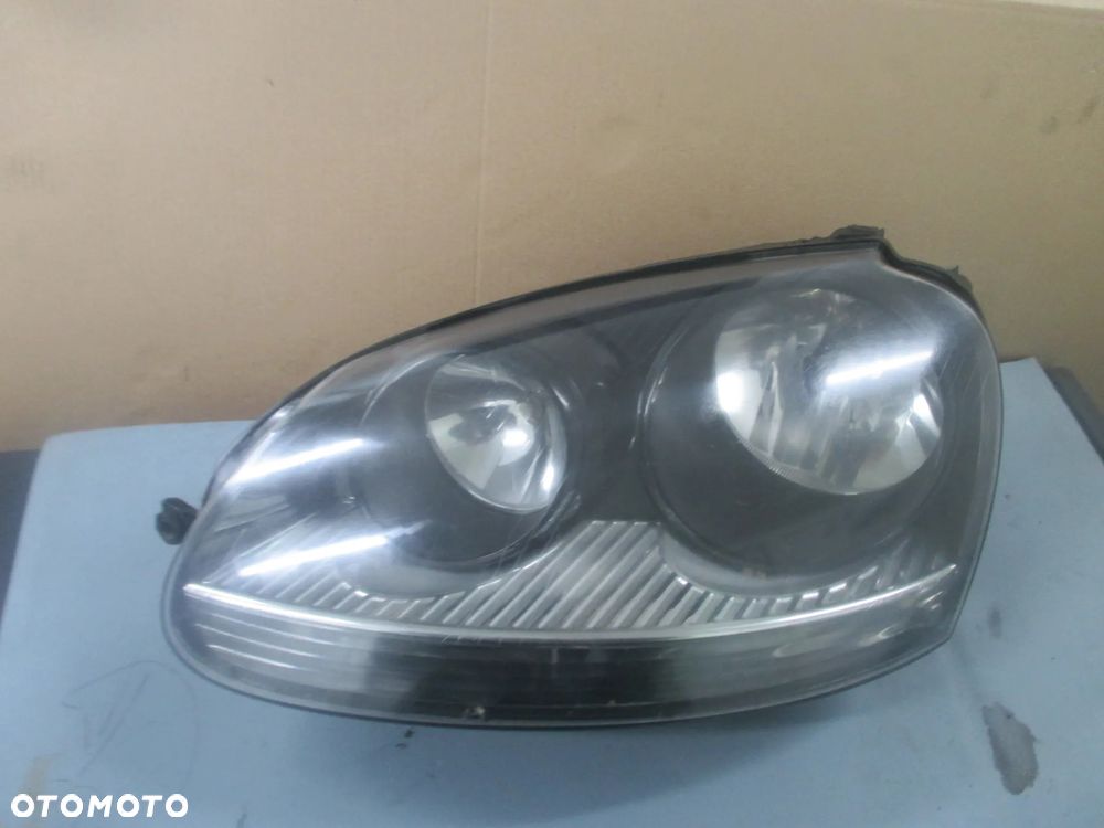 lampa lewa Golf V GT Hella Europa - 1