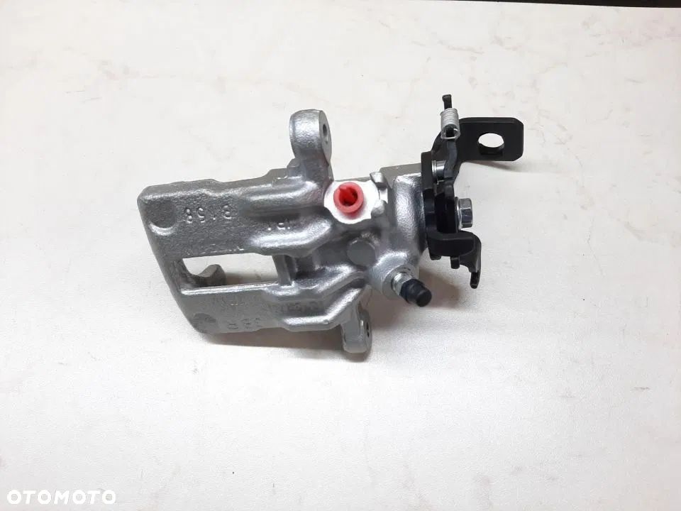 Zacisk tył Lewy Prawy Nissan Almera II  N16 Primera P11 Almera Tino V10 - 2