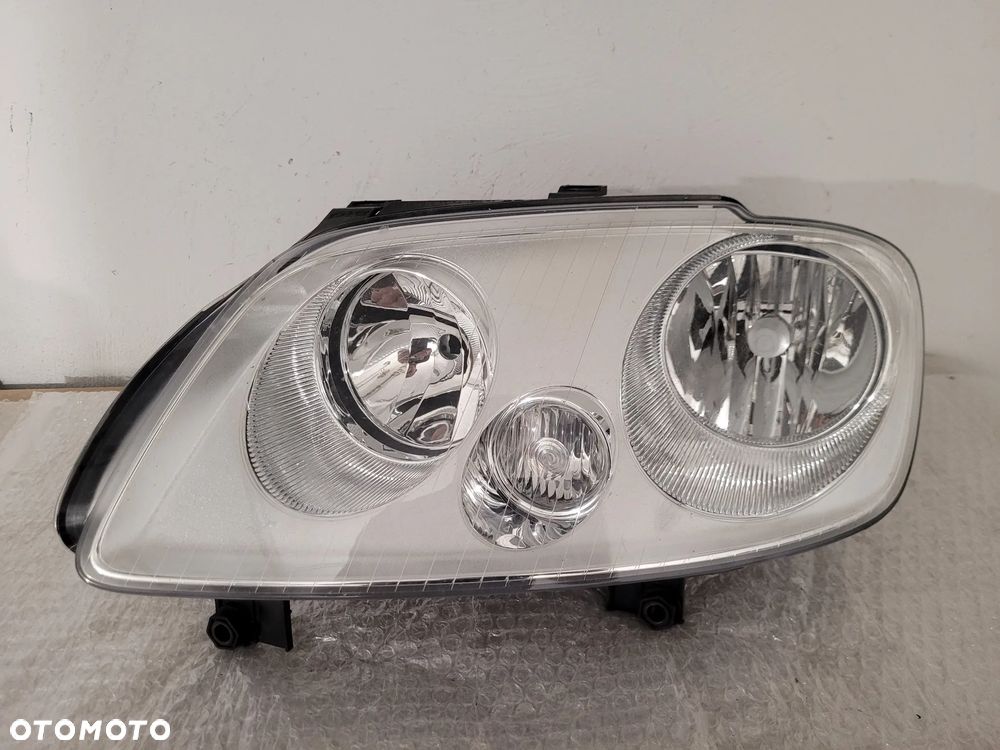 Vw Caddy lampa przód lewa zwykła