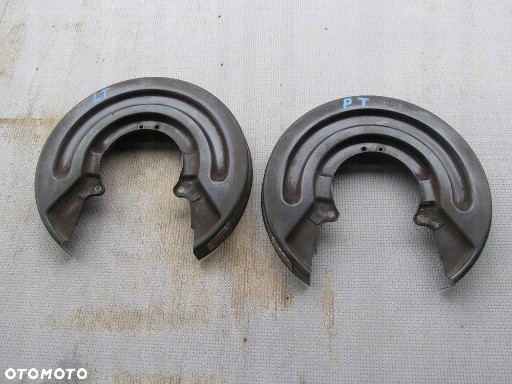 VW T5 LIFT osłona tarczy hamulcowej prawy tył 7E0615611 - 1