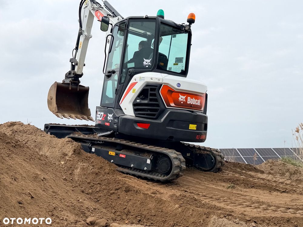 Bobcat Minikoparka Bobcat e50Z 5ton e55 e60 Cat 303.5 304  305 3xłyżki Ramię LOONG dodatkowe linie hydr wyjścia AUX1 + 2 przeciw waga MAX-dociążenie gąsienice 85% od nowości 1 właściciel z Niemiec Auto IDLEE po serwisie Widły wiertnica grabie i inne za dopłatą Szybkozłącze hydr Miller łyżka przedsiębierna Pług  Kubota Takeuchi Jcb - 7