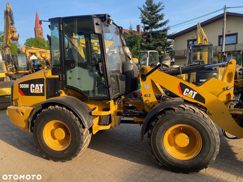 Caterpillar CAT 908M, 2017 ROK, 3900 MTH, ŁYŻKA OTWIERANA + WIDŁY, z NIEMIEC, - 11