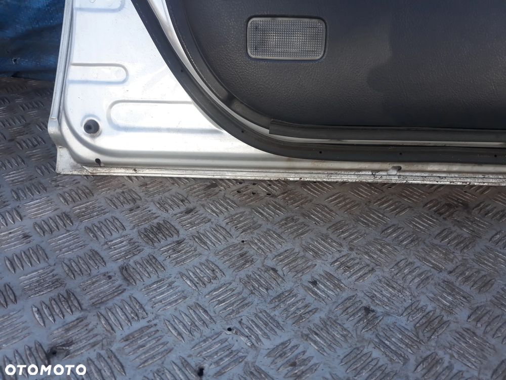 DRZWI LEWY PRZÓD TOYOTA AVENSIS II T25 LIFT 2007r  KOLOR: 1C0 - 8