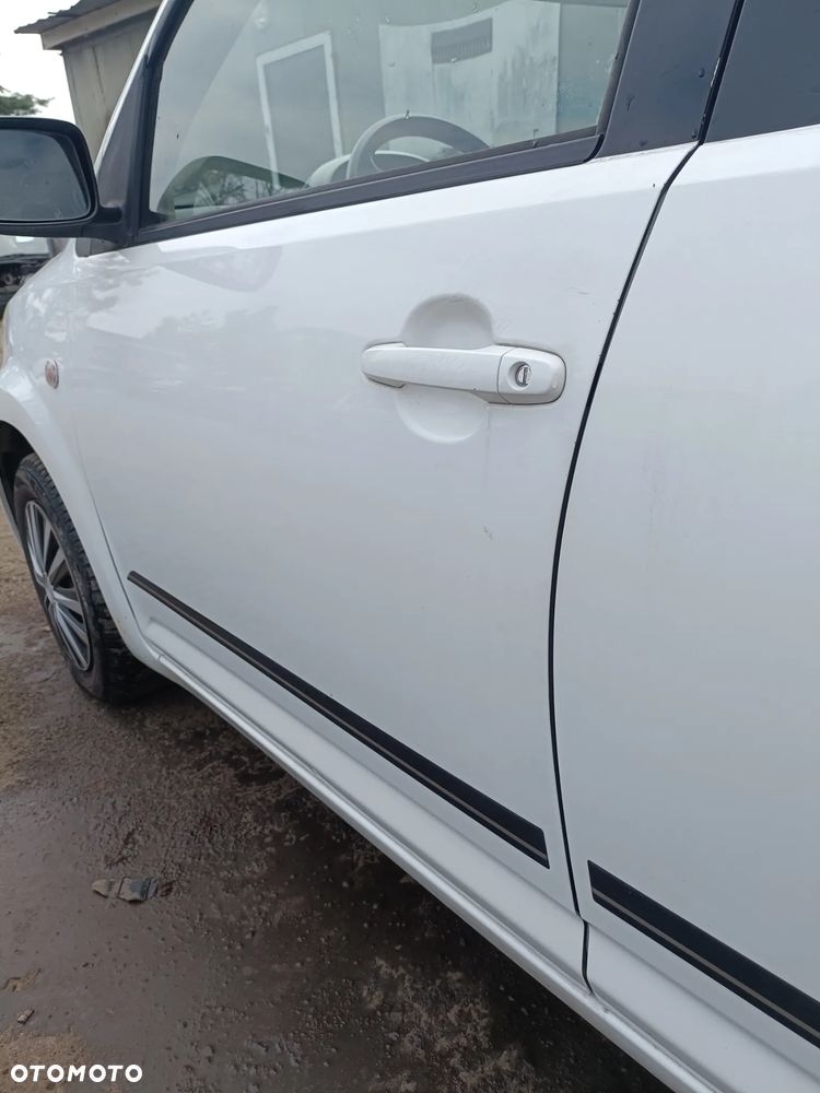 DAIHATU SIRION II 04-10 r. W09 DRZWI lewy przód lewe ** - 6
