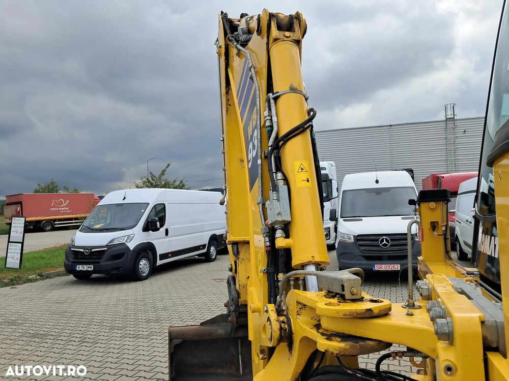 Komatsu wb93r-8 4x4 cupa multifunctionala 4 cupe brat telescopic - 10