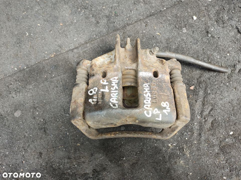 Mitsubishi carisma 1,8 zacisk jarzmo przód LEWE - 1