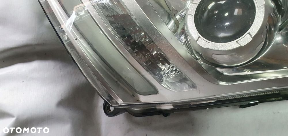 VOLVO FH4 LAMPA LEWA BI XENON 21221138 - 2