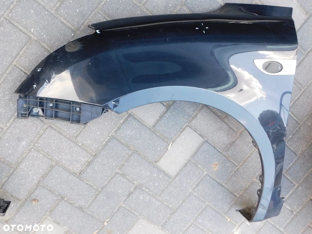błotnik lewy przód SUZUKI SWIFT IV MK6 04-10 czarny