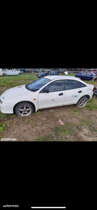 Dezmembrez Mazda 323 - 3