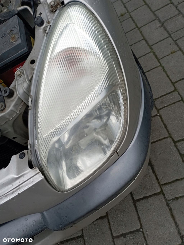 DAIHATSU SIRION I LAMPA LEWA PRZÓD PRZEDNIA EU