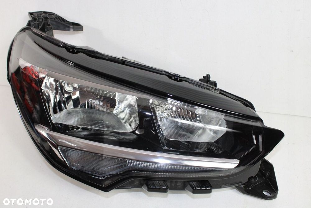Opel Corsa F REFLEKTOR ZWYKŁY PRAWY UŻYWANY ORYGINALNY GM 39162649