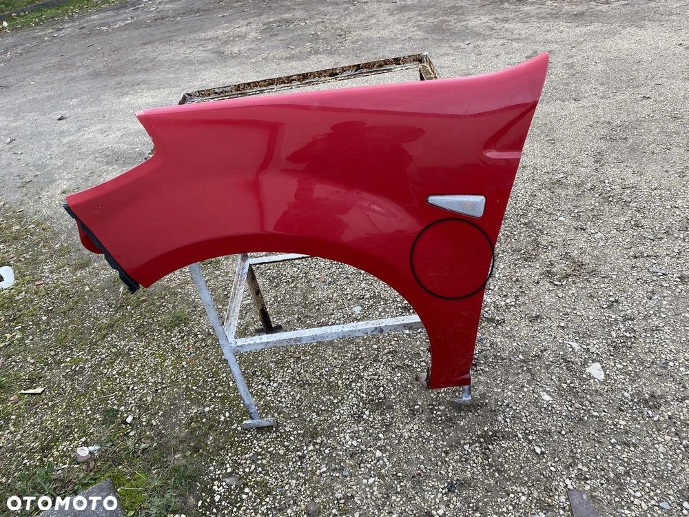BŁOTNIK PRZEDNI LEWY DACIA SANDERO I 08-12 LAKIER DV210 6001551026 - 6