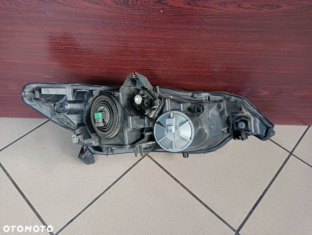 Honda Insight lift lewy reflektor lampa przednia Europa - 2