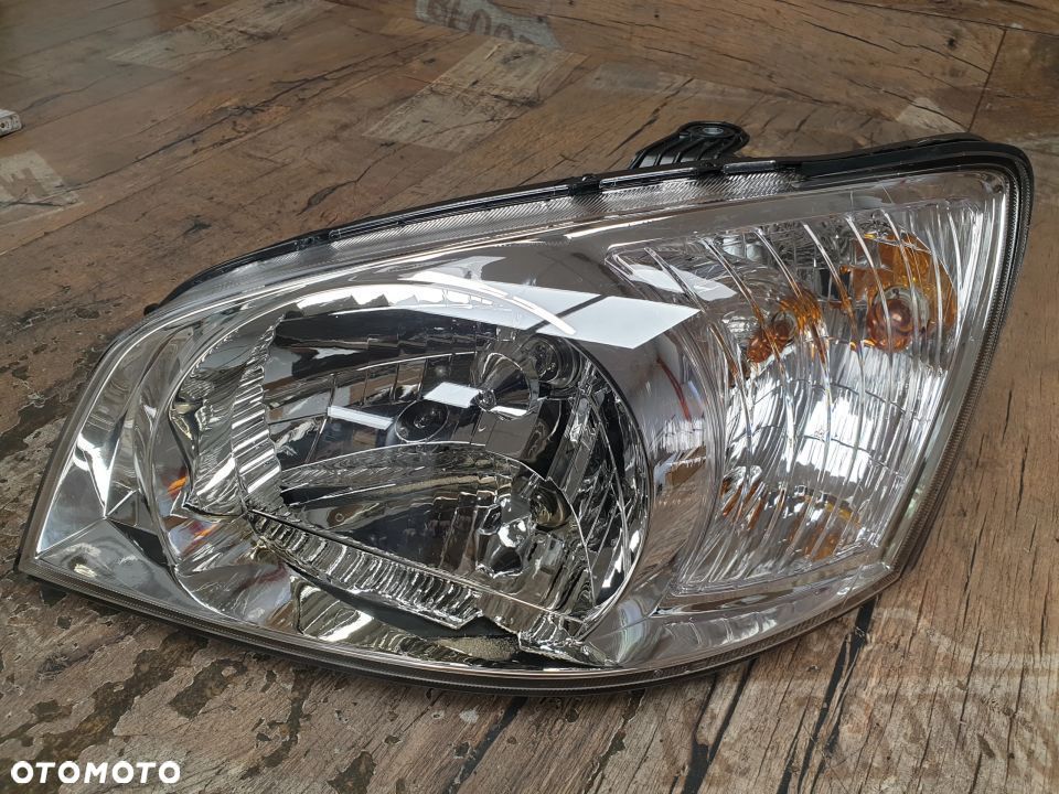 Oryginalna lampa lewa reflektor Hyundai Getz 92110-1C010 - 4