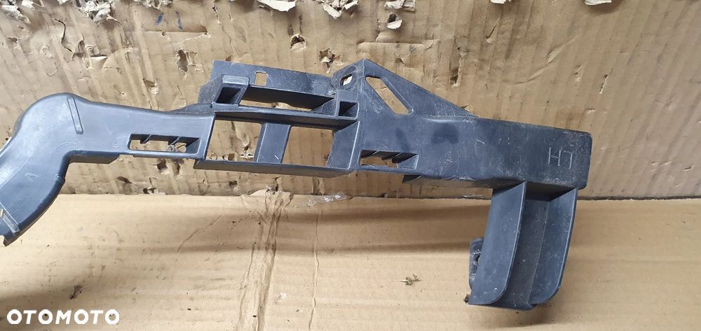 Ślizg mocowanie lampy lewy przód Opel Zafira C 13300782 - 3