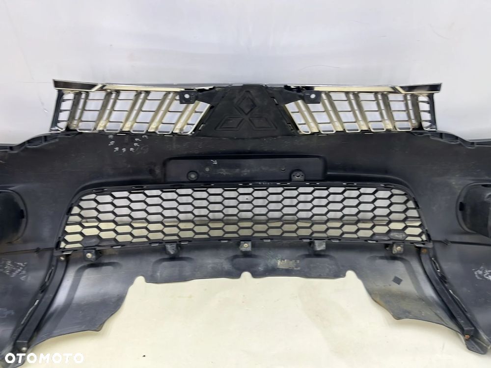 Zderzak przedni Mitsubishi Pajero Sport 2 L200 10-15r. Lift przód 6400B862 - 12