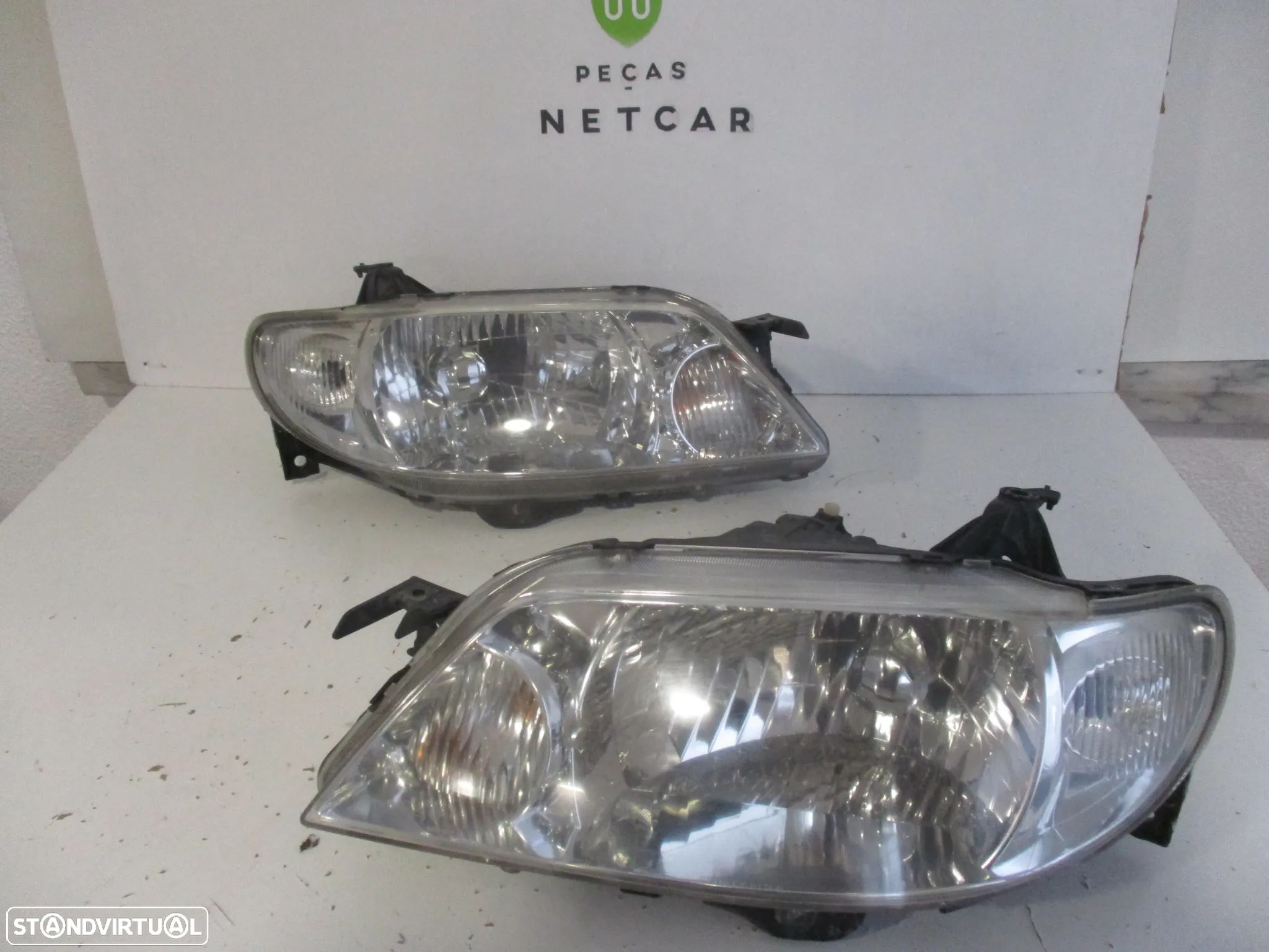 farol optica mazda 323F 2000 - 1