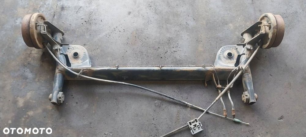 BELKA OŚ ZAWIESZENIA TYŁ BĘBNY BEZ ABS RENAULT THALIA I - 2