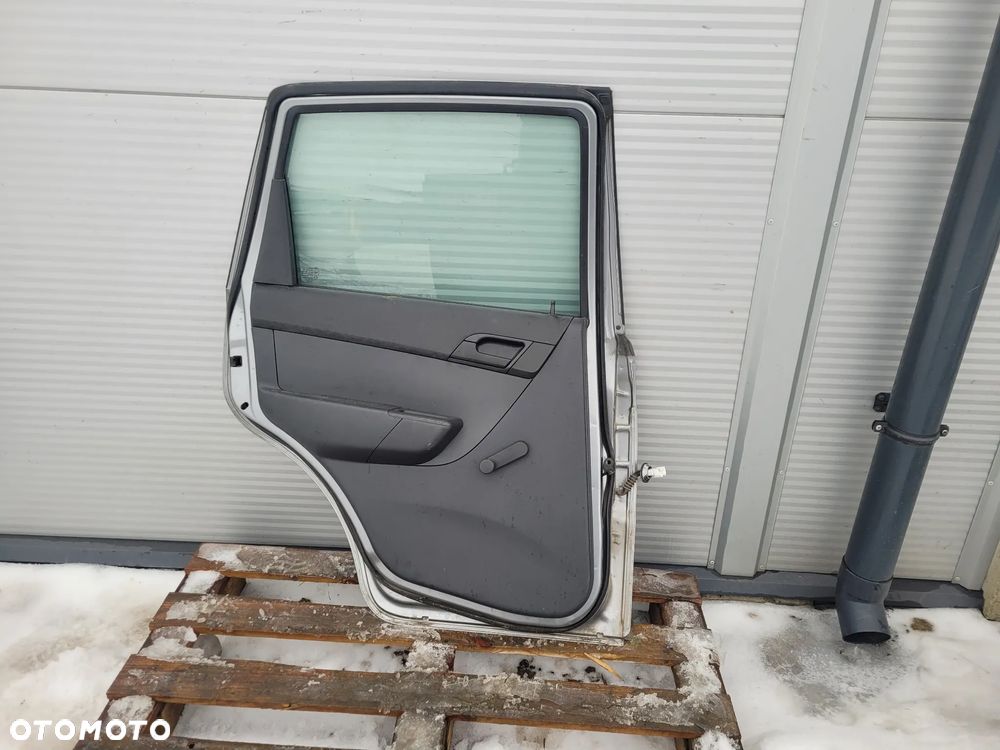 Chevrolet Aveo II 09r T255 5d hb Drzwi lewy przod - 11