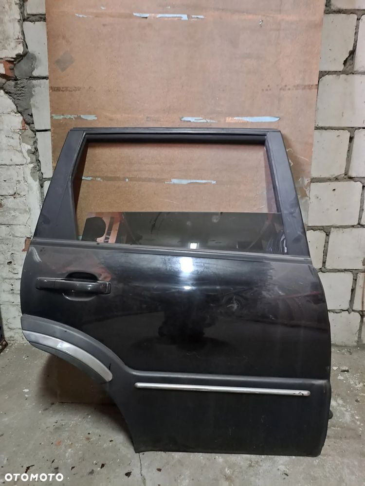 Drzwi Ssangyong Rexton I 01-07' prawy tył (czarne) - 1