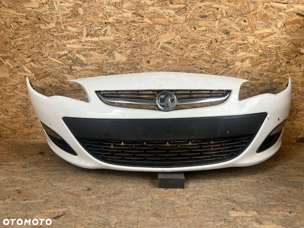 ZDERZAK PRZEDNI przód OPEL ASTRA J IV 4 LIFT PDC Halogeny BIAŁY