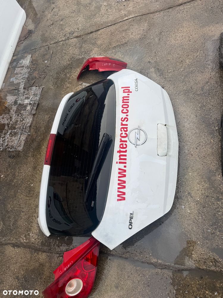 Opel Corsa D biała maska drzwi prawe lewe przednie przód pas przedni chłodnice wody klimy lampy lampa przednia prawa lewa błotnik prawy lewy biały białe zderzak przód przedni klapa bagażnika klapa tył tylnia lampa prawa lewa belka pod zderzak - 11