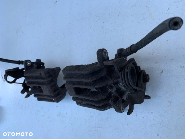 VW PASSAT B5 ZACISK HAMULCOWY LEWY TYŁ 4x4 ORG 38