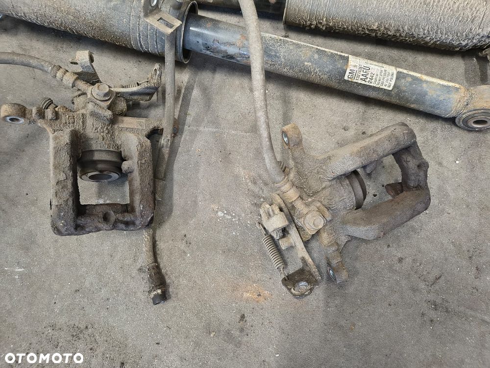 OPEL ASTRA J IV ZACISK HAMULCOWY TYŁ LEWY PRAWY - 1