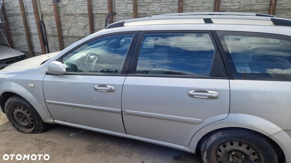 CHEVROLET LACETTI KOMBI 2004-DRZWI LEWY TYŁ 92U - 1
