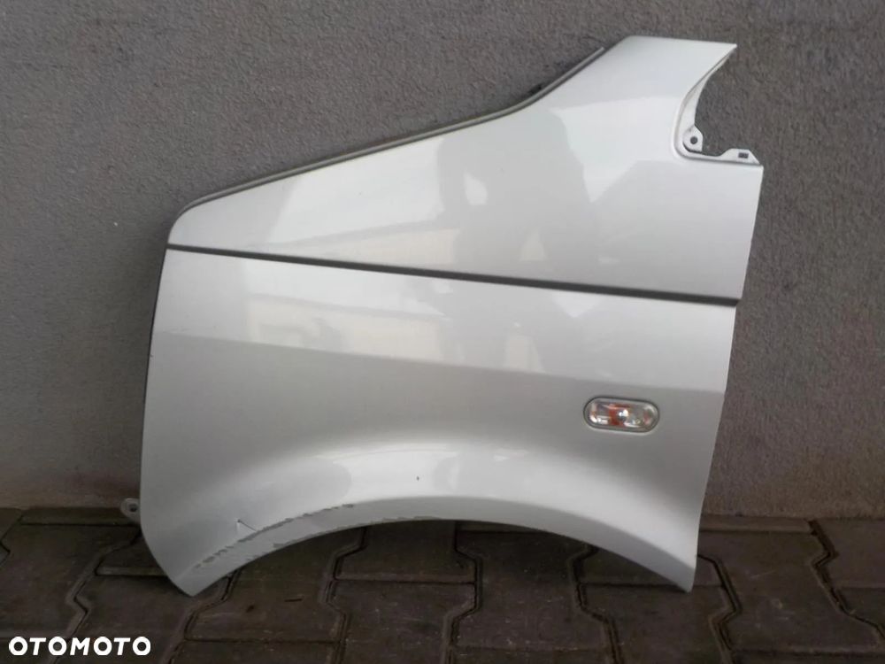 VW T5 BŁOTNIK LEWY PRZÓD ZDROWY LA7W - 1