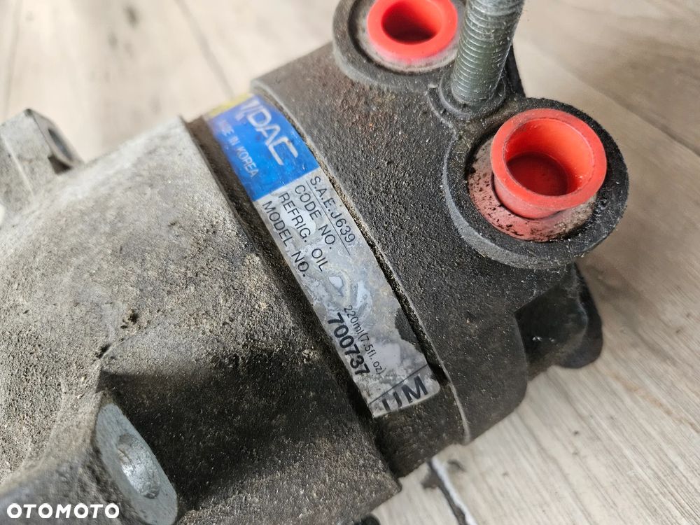 Sprężarka kompresor klimatyzacji Daewoo Rezzo Tacuma 2,0 b 2001r 700737 UM - 2
