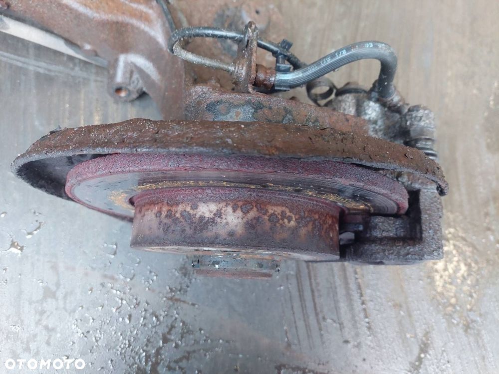 BELKA OŚ ZAWIESZENIA TYŁ TARCZE Z ABS OPEL ASTRA H HB 5D - 2