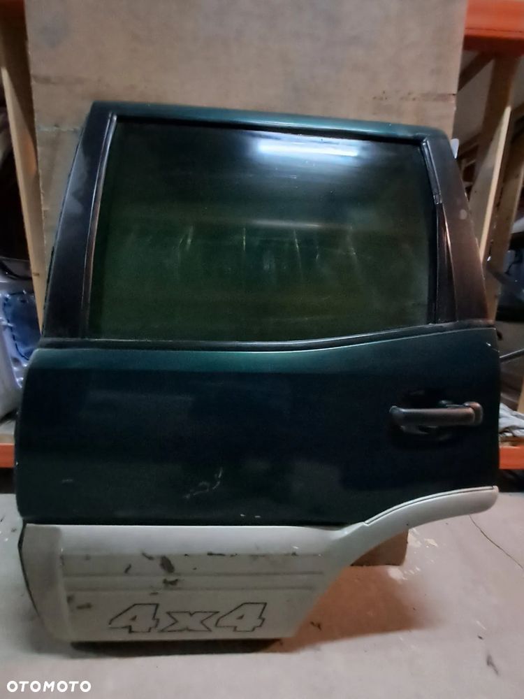 Drzwi Nissan Terrano II 93-03' lewy tył (ciemna zieleń)