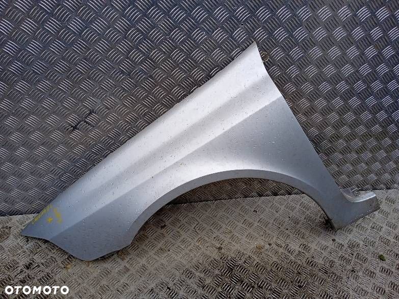 BŁOTNIK LEWY PRZEDNI RENAULT LAGUNA 2 - 1