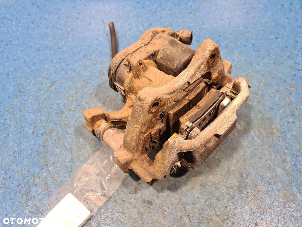 TOYOTA COROLLA E21 ZACISK HAMULCOWY TYŁ LEWY - 9